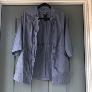 Grey cape-like raincoat. Axcess brand. Size S.